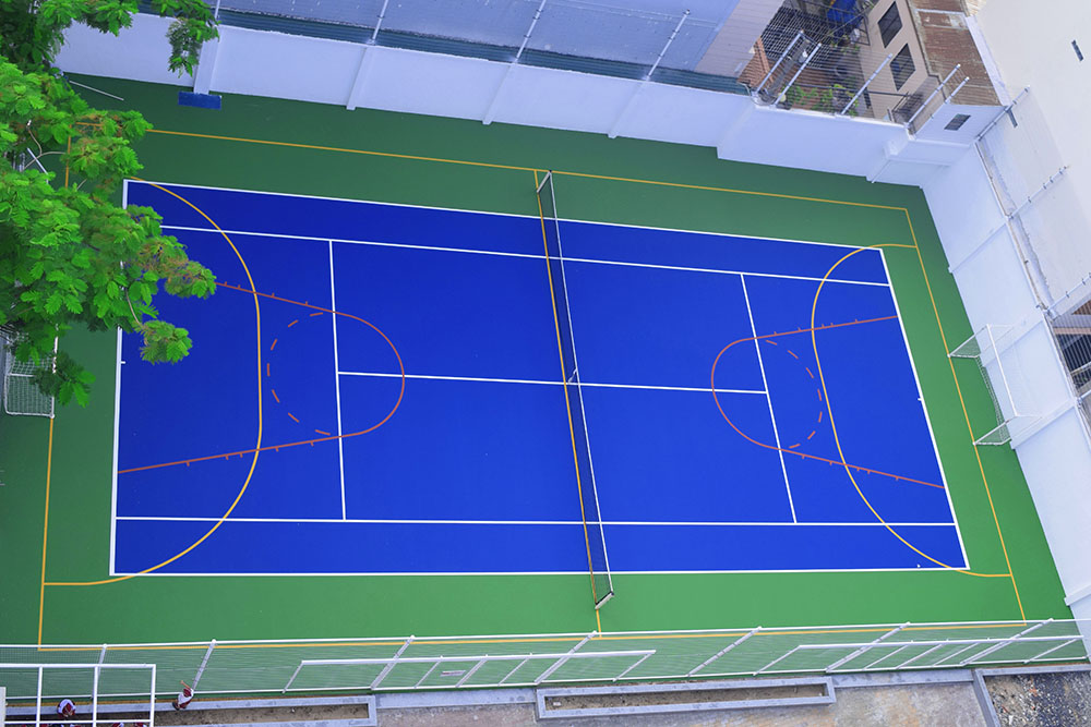 Thi công sân đa năng: Tennis, bóng đá Trường Quốc Tế Á Châu